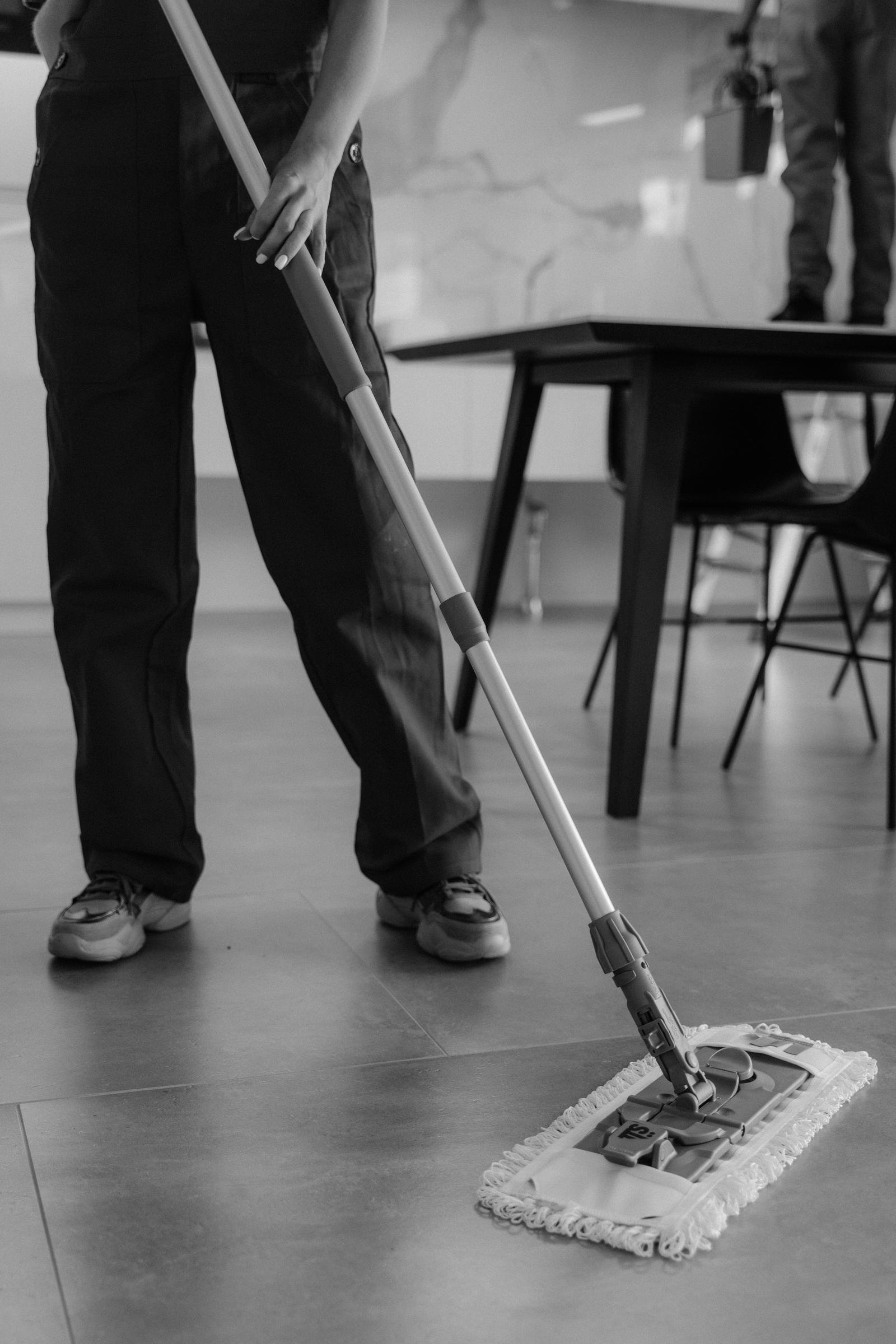 PureCare cleaner mopping a floor to a checklist-verified standard
